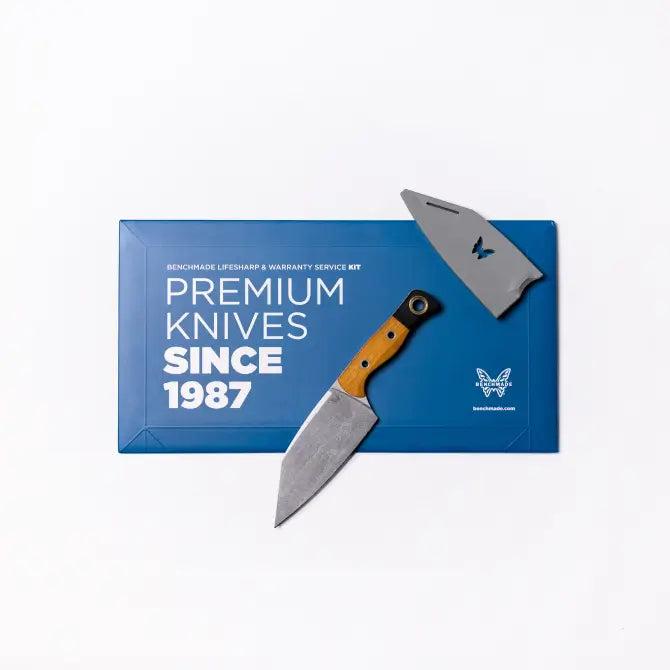 Wood-handled knife and gray sheath on blue Benchmade box reading "Premium Knives Since 1987."