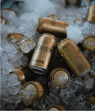 Gold Friem Lager cans nestled in ice.