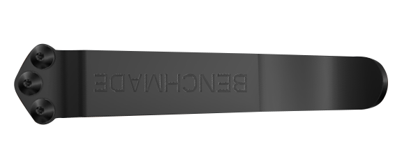 Black metal clip with three rivets and embossed text on the flat surface, side view.