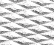 White textured component surface with diagonal ribbed pattern, close-up view.